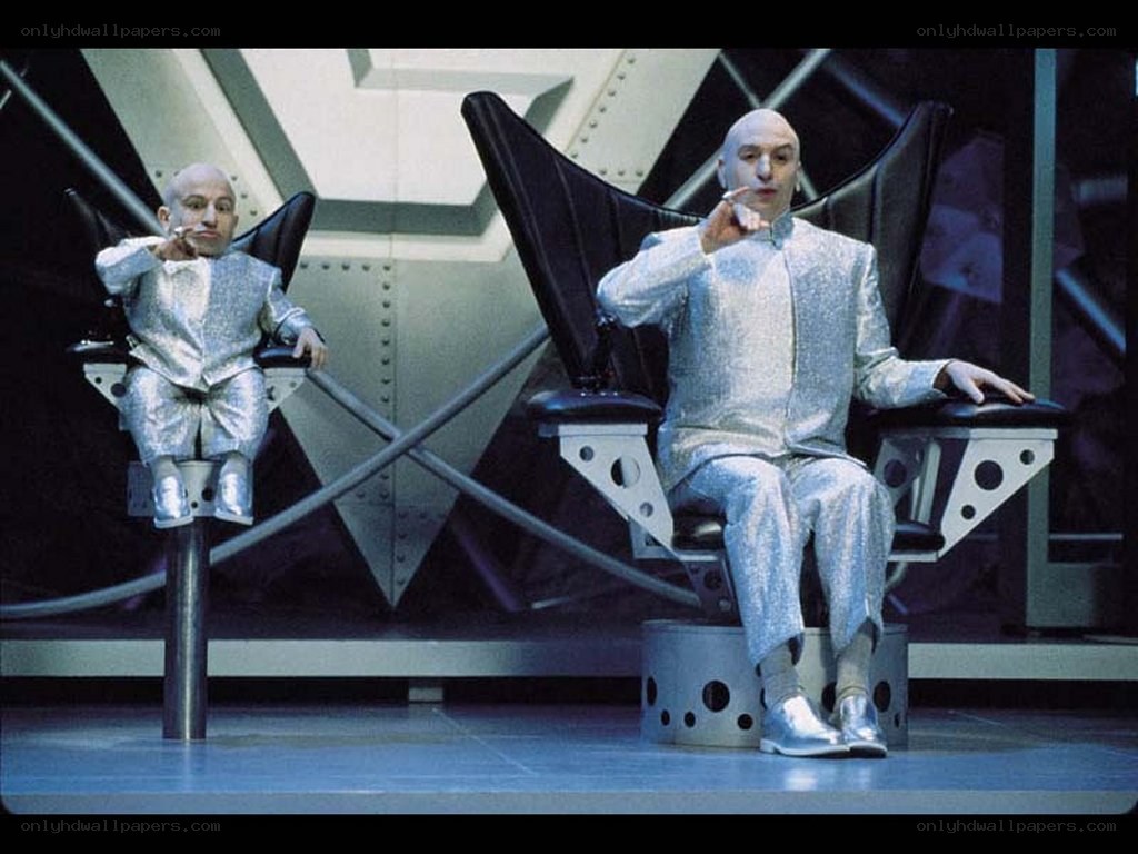 Two men in silver suits on stage