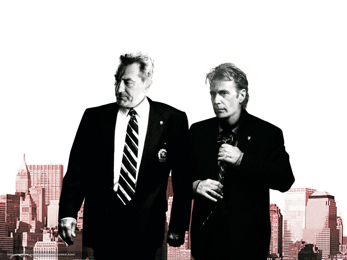 two men in suits against cityscape