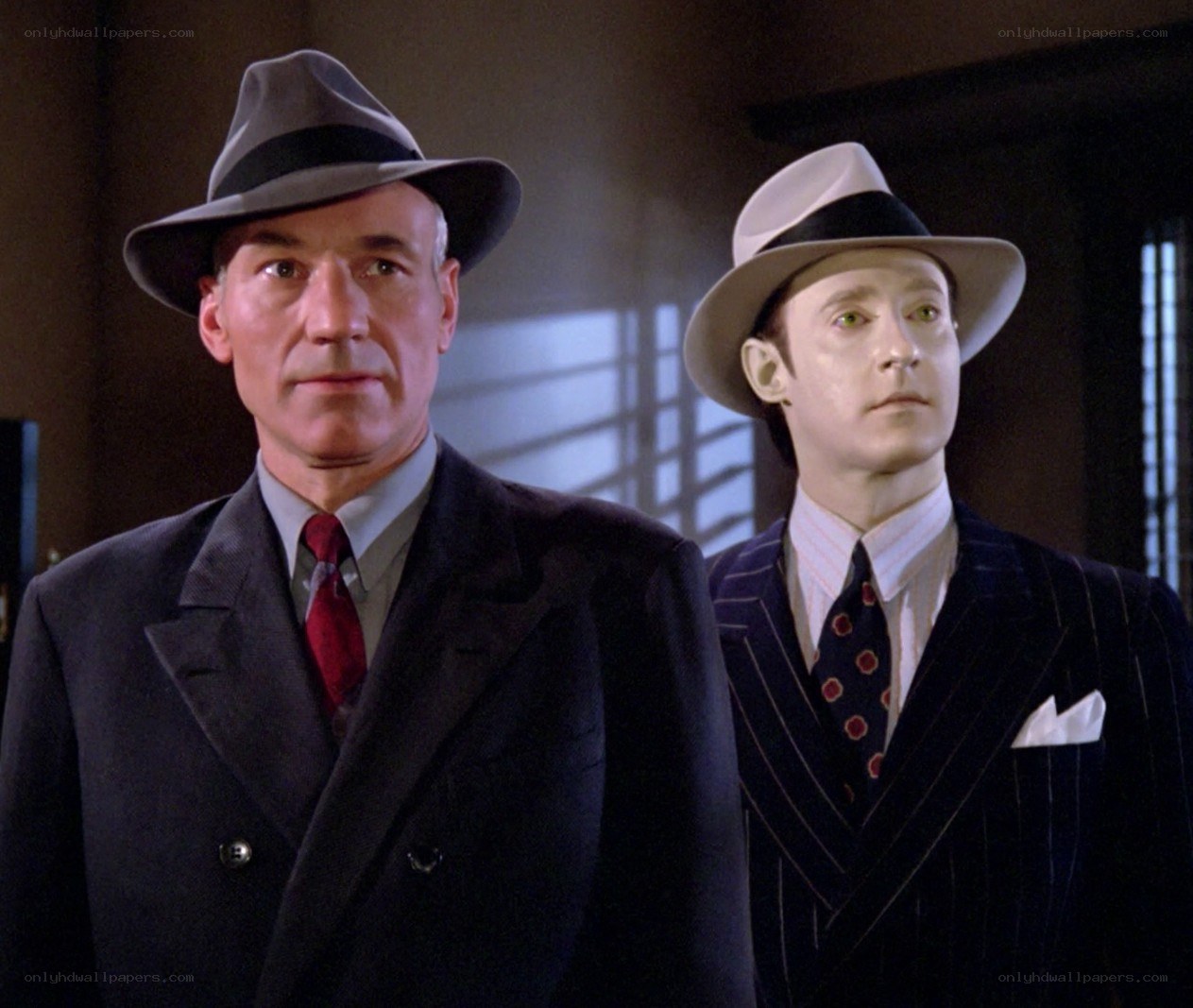 Two men in suits and hats