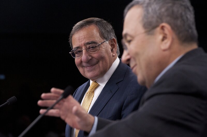 Two men in suits at a conference