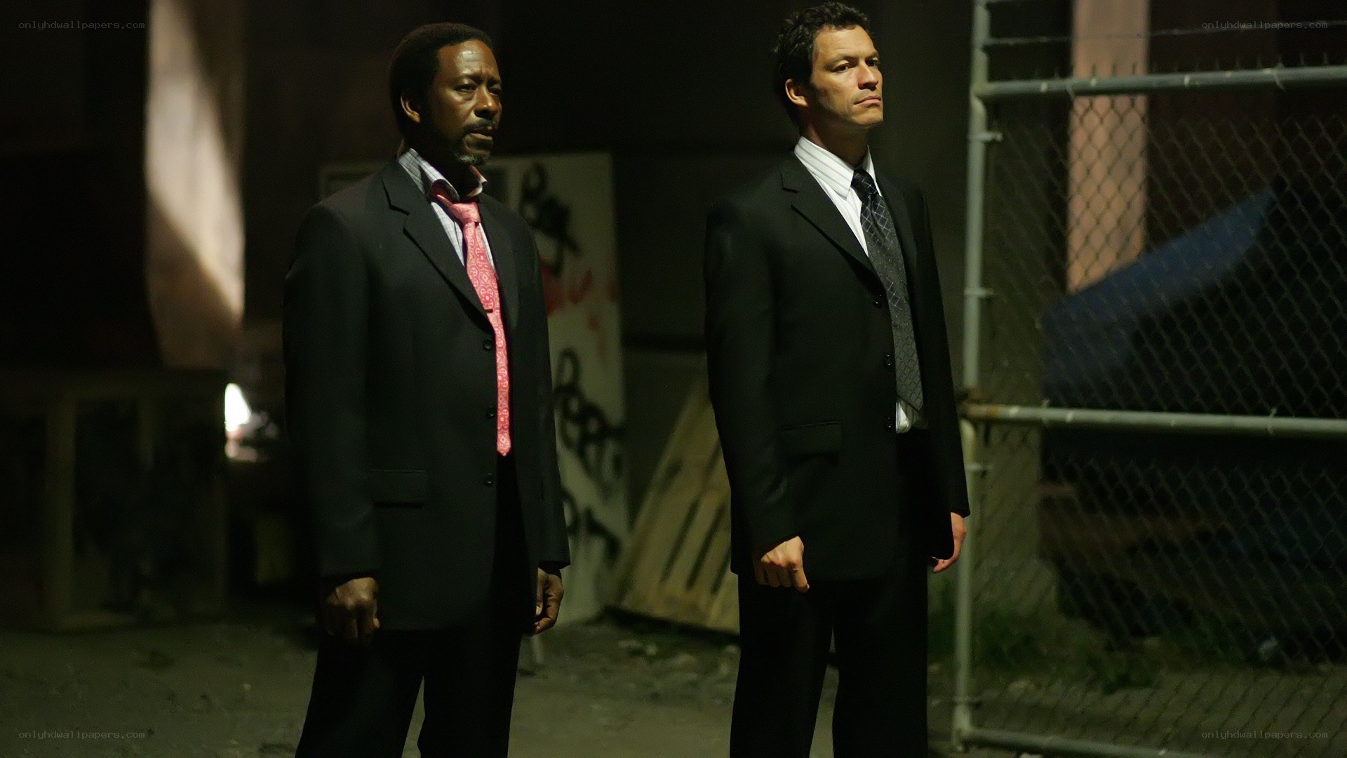 Two men in suits at night