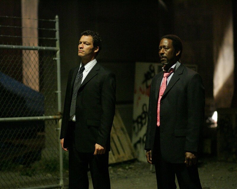 two men in suits at night