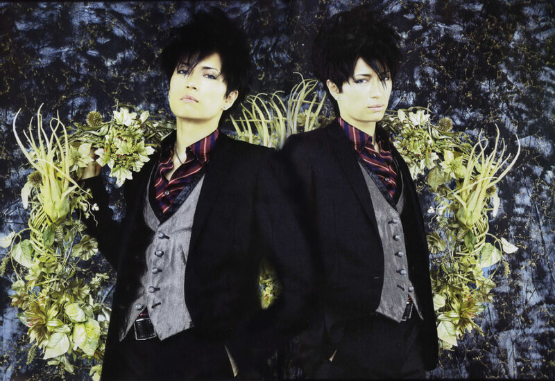 Two Men in Suits — Black, Dramatic, Photograph, Flowers