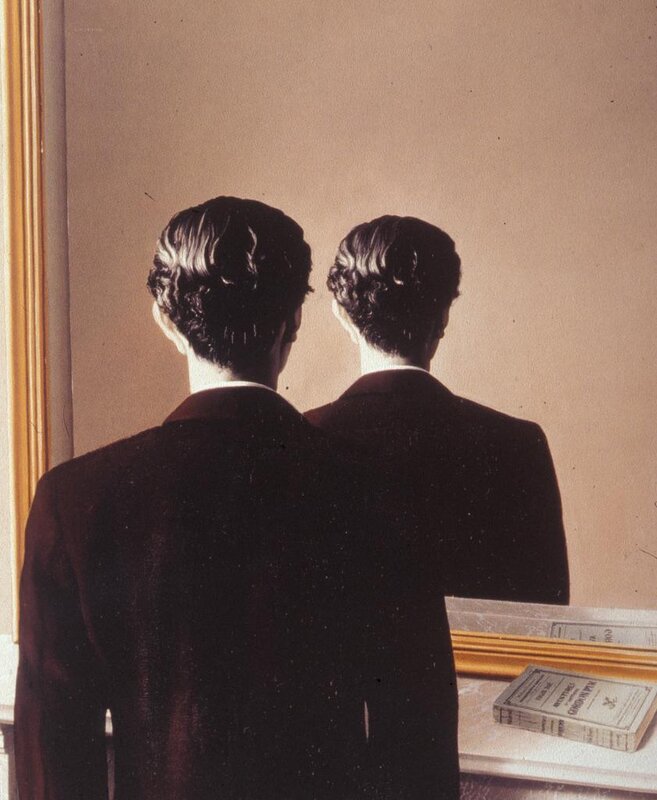 two men in suits from behind