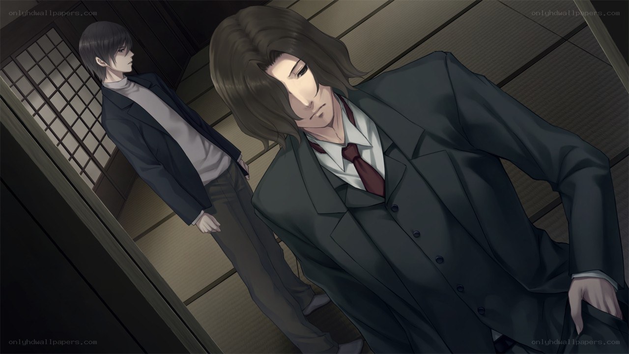 two men in suits in a room