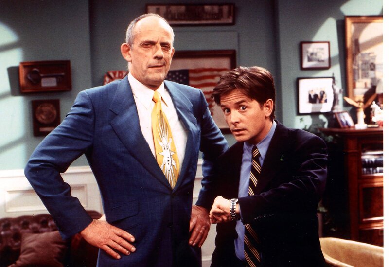 Two men in suits in an office