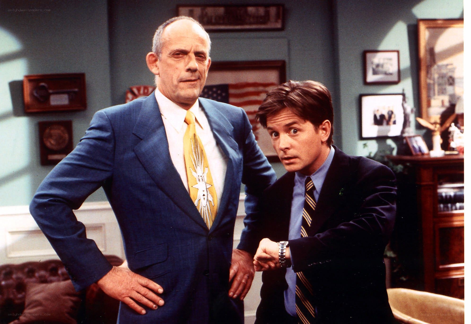 Two men in suits in an office