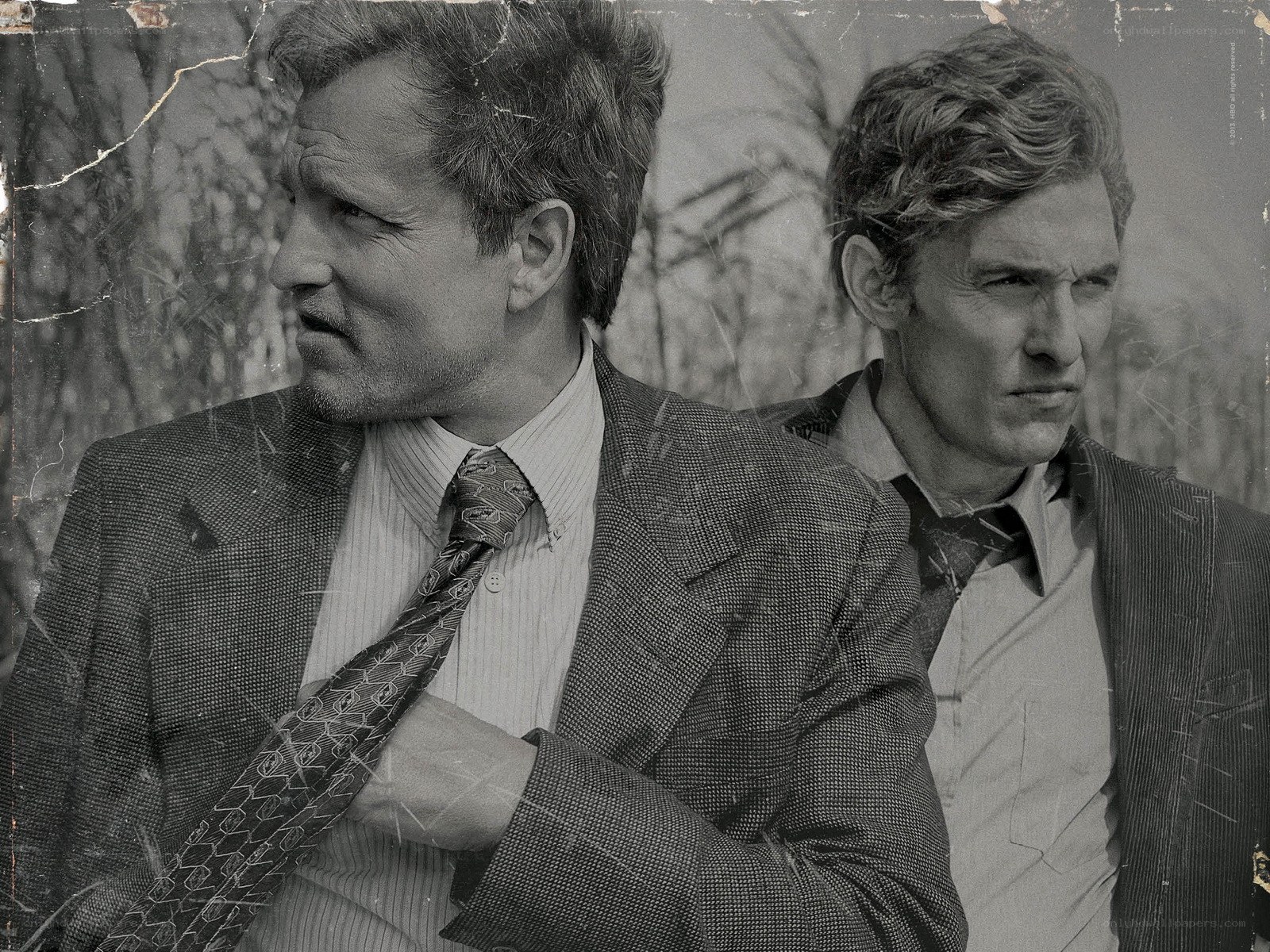 two men in suits looking serious