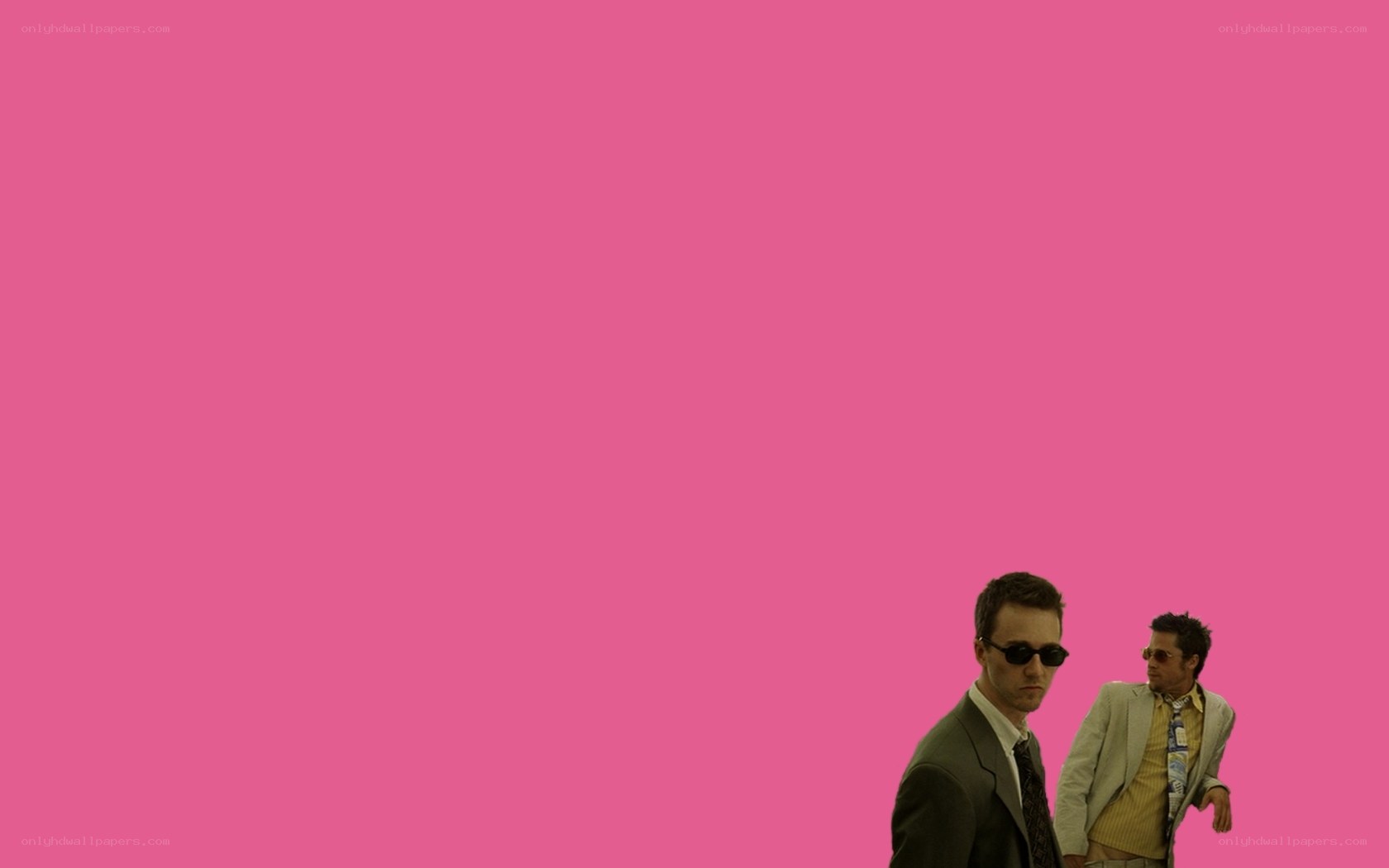 two men in suits on pink background