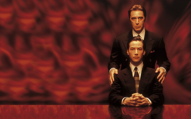 Two men in suits on red background