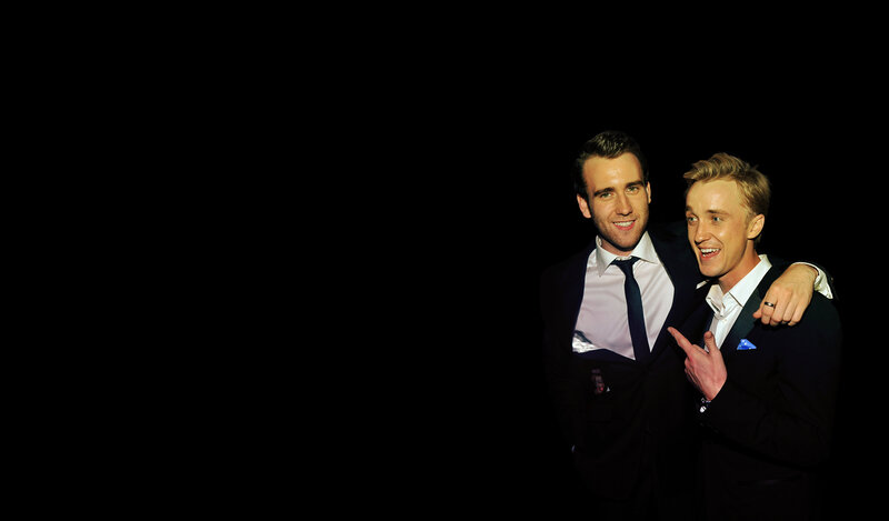 two men in suits posing