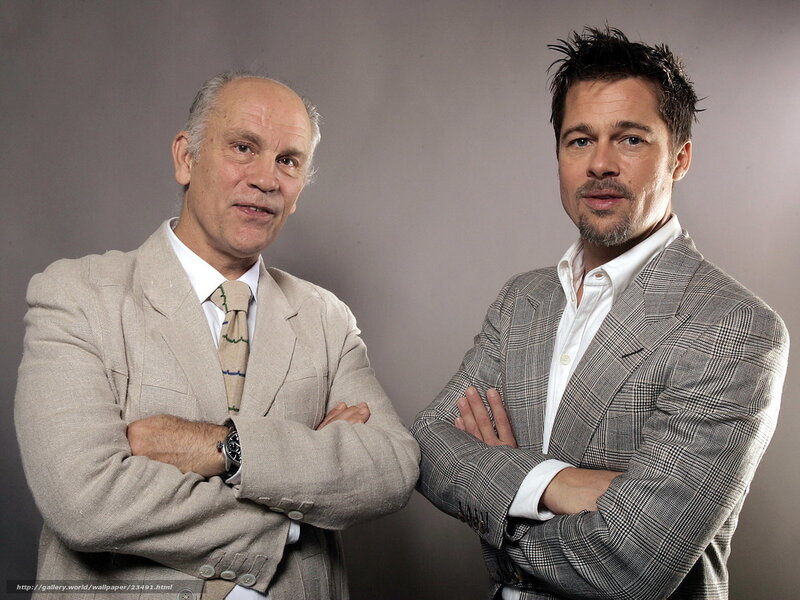 two men in suits posing