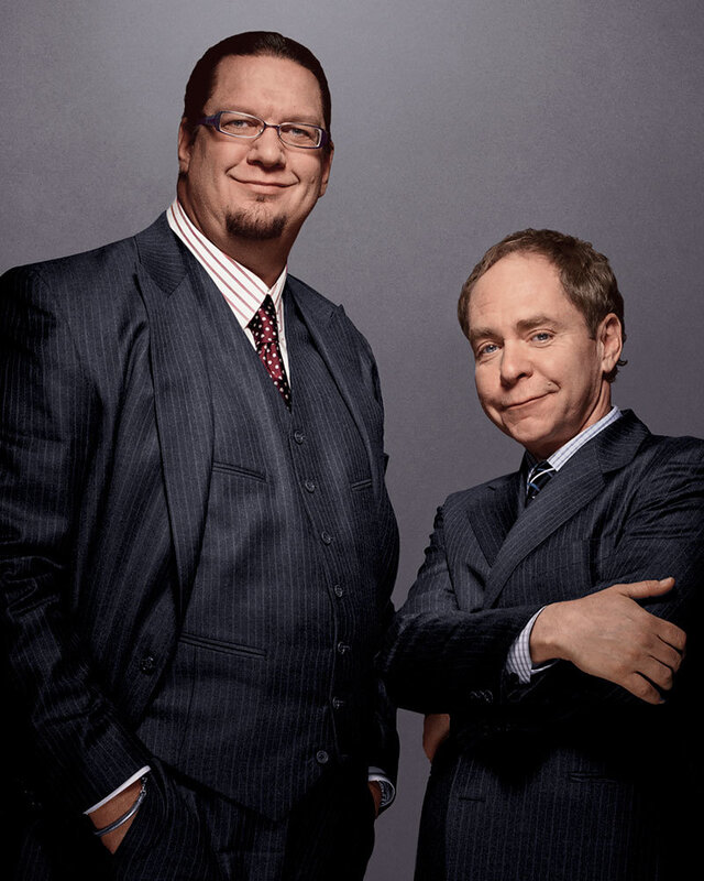 Two men in suits posing together
