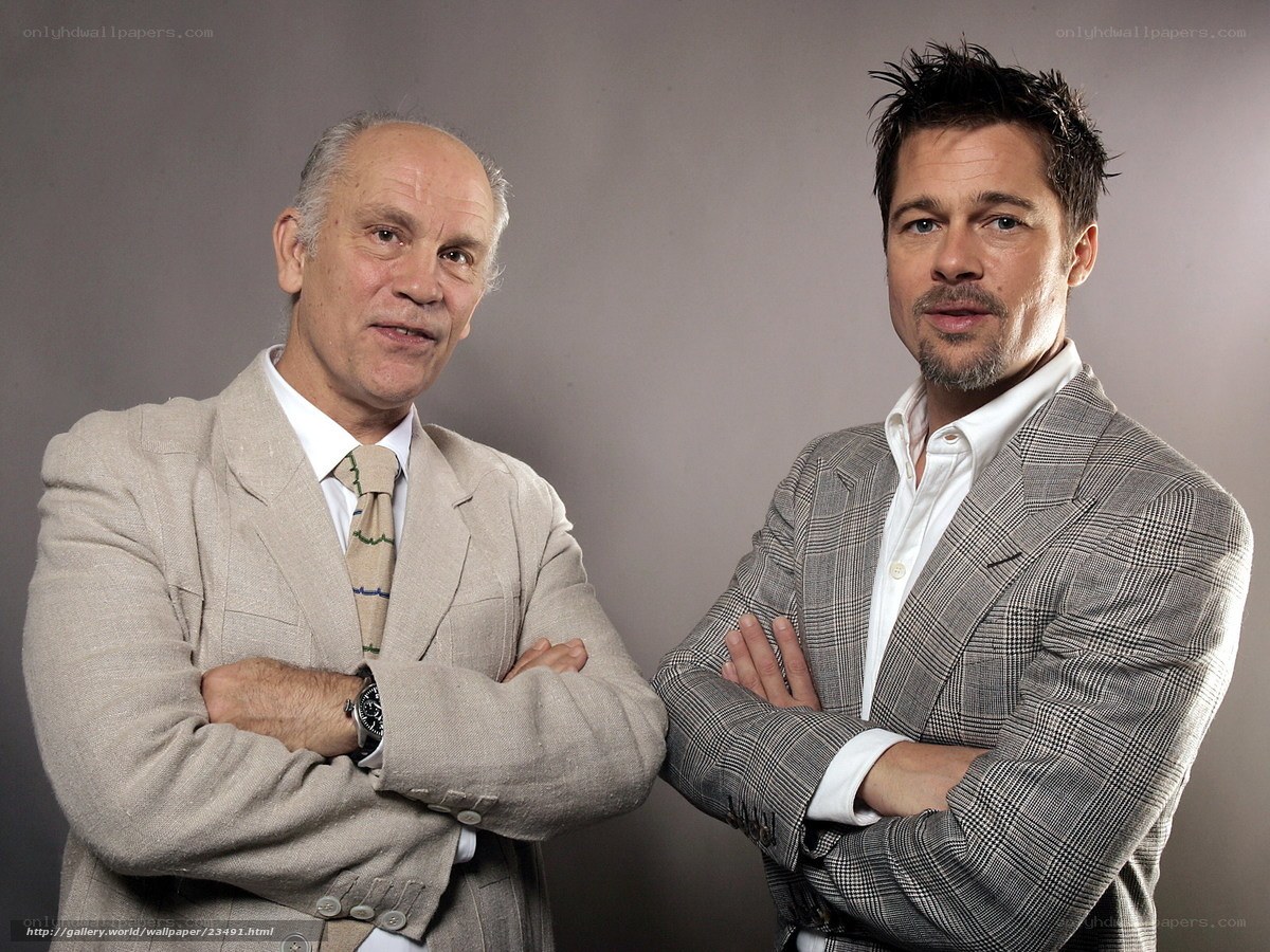 two men in suits posing