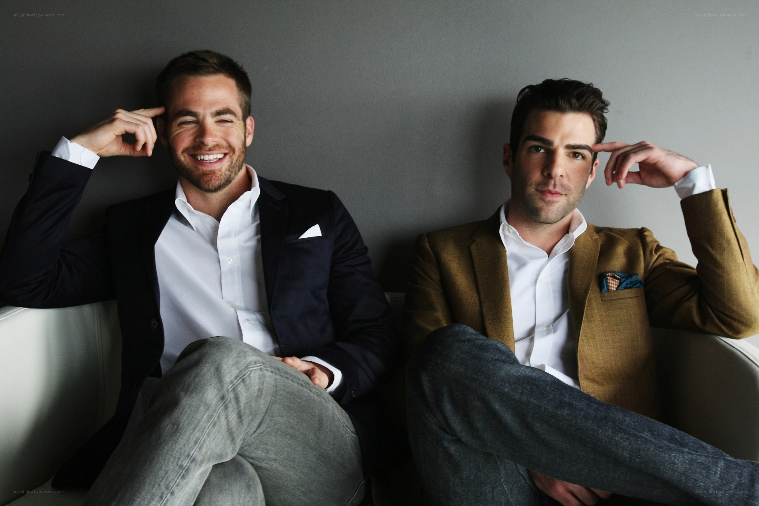 Two men in suits sitting together