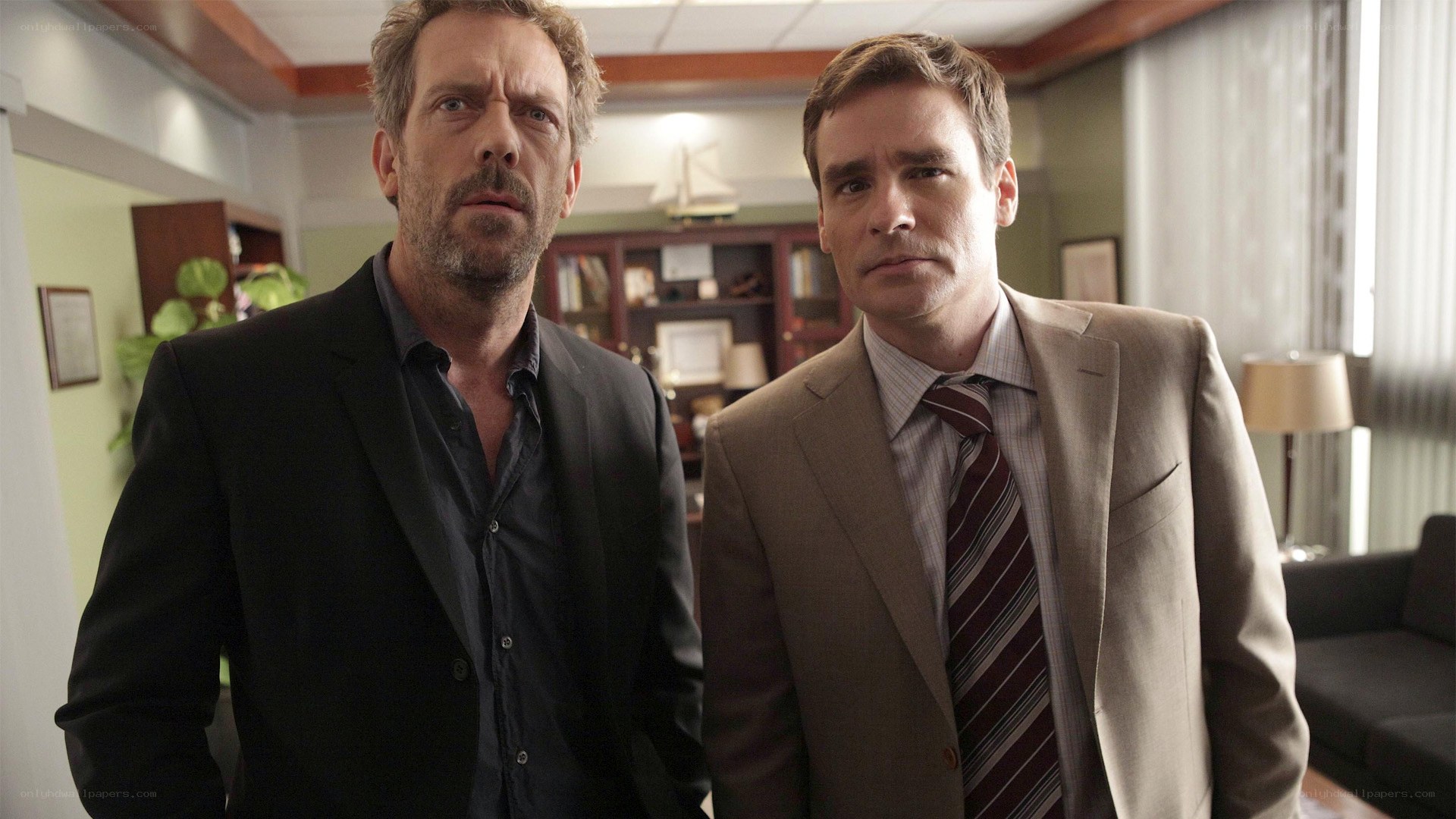two men in suits standing