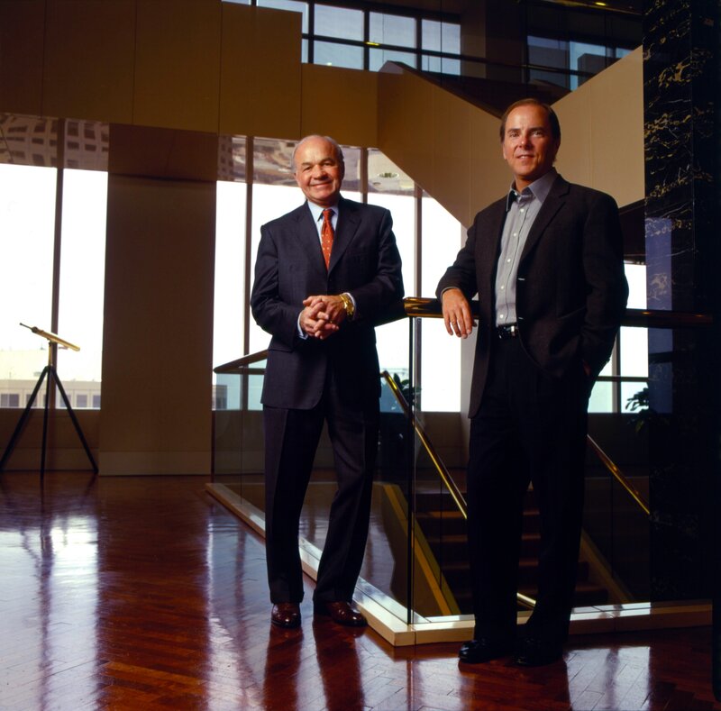 Two men in suits standing together