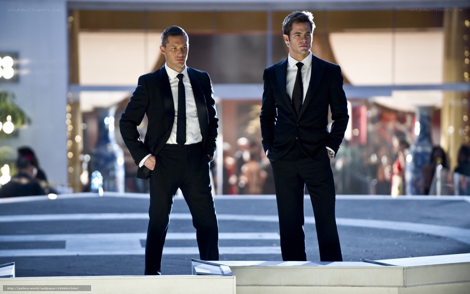 Two men in suits standing