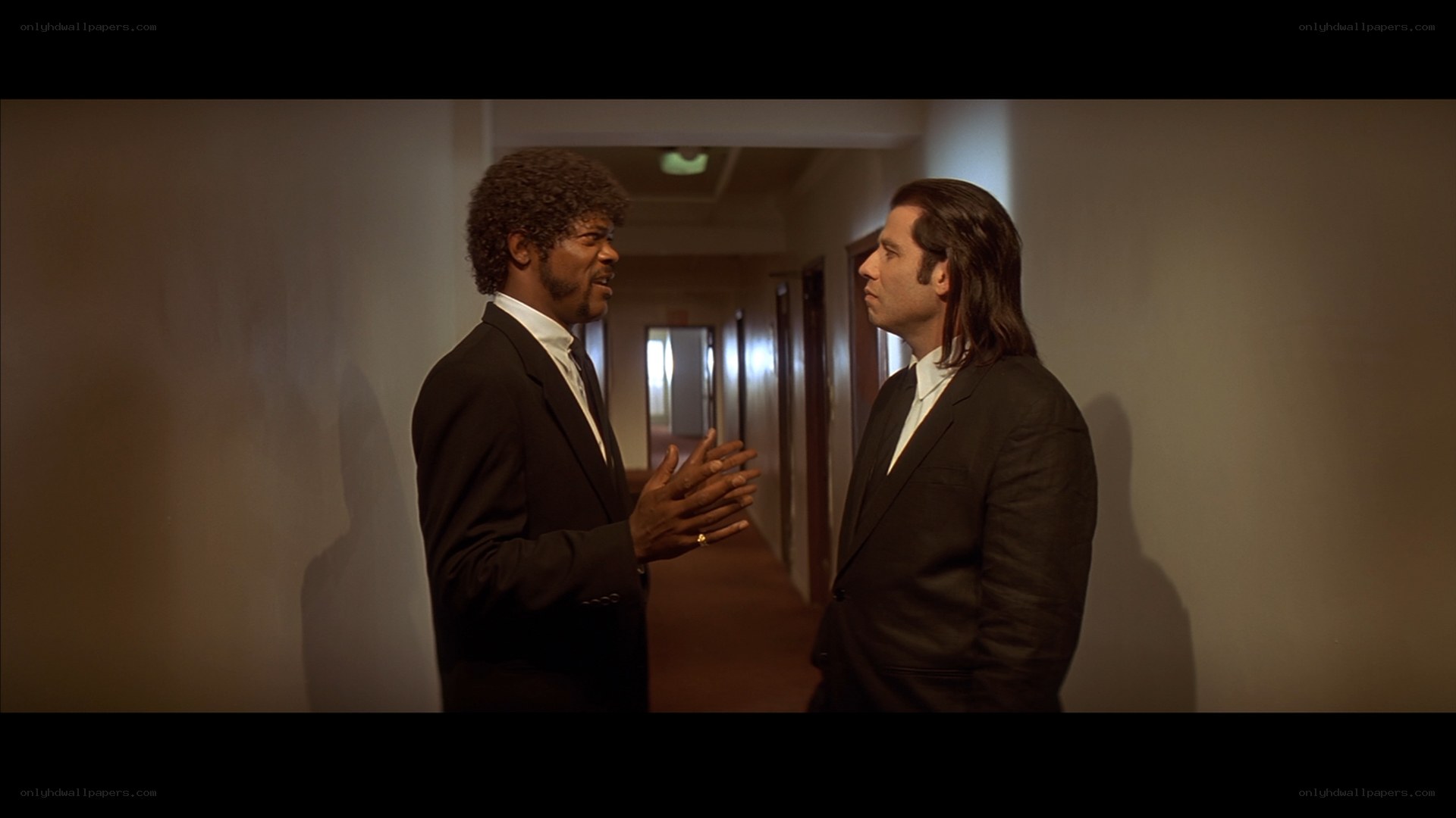 Two men in suits talking