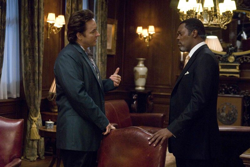 two men in suits talking