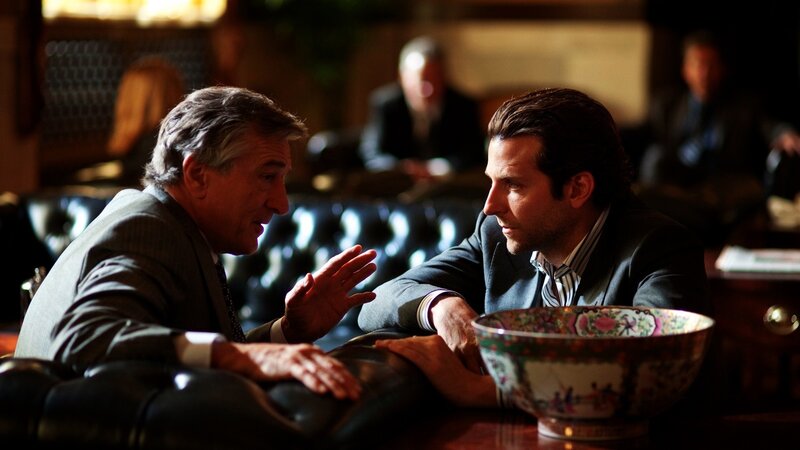 two men in suits talking