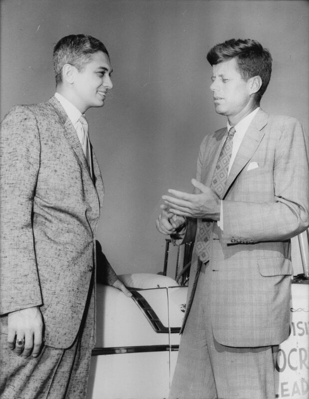 Two men in suits talking