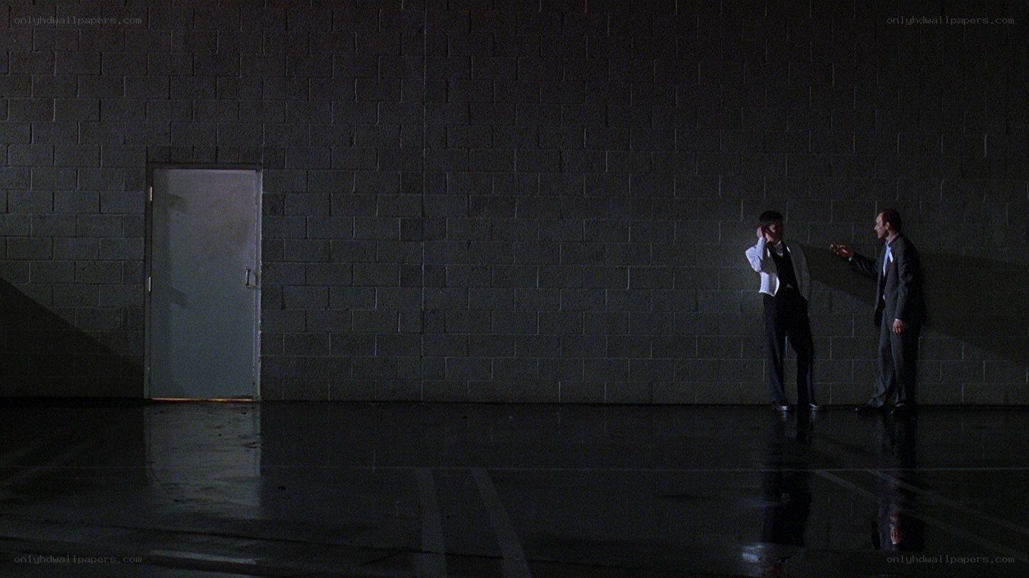 Two men in suits talking