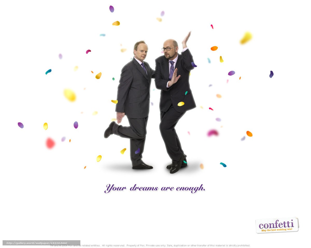 Two men in suits with confetti