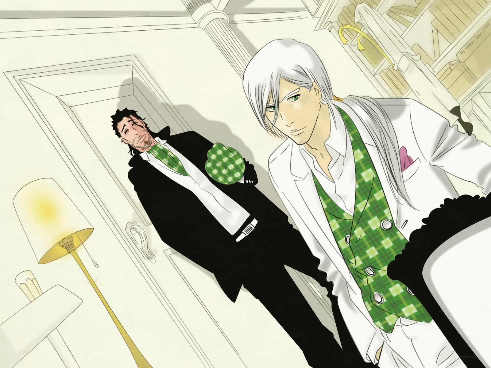 Two men in suits with green ties