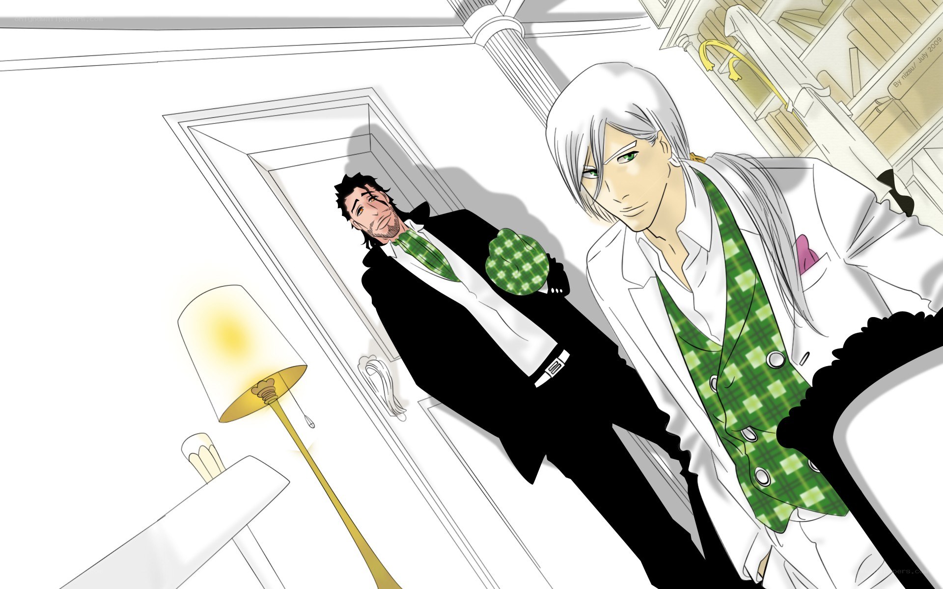 Two men in suits with green vests