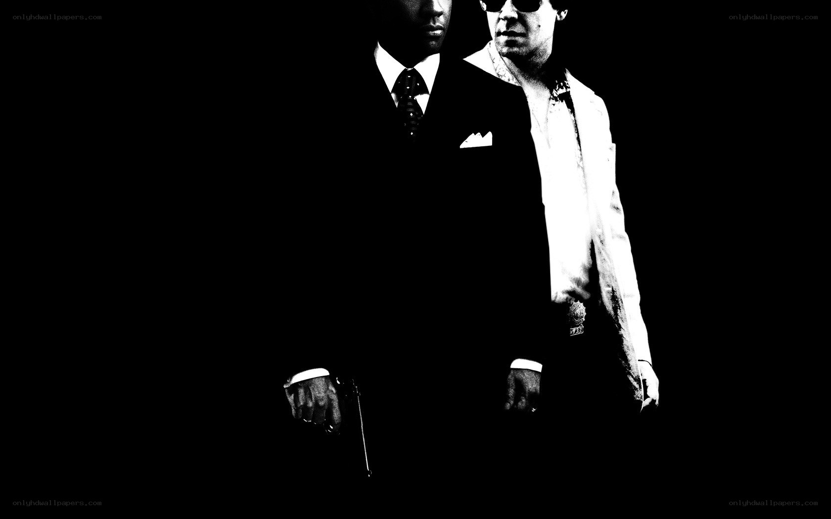 two men in suits with guns