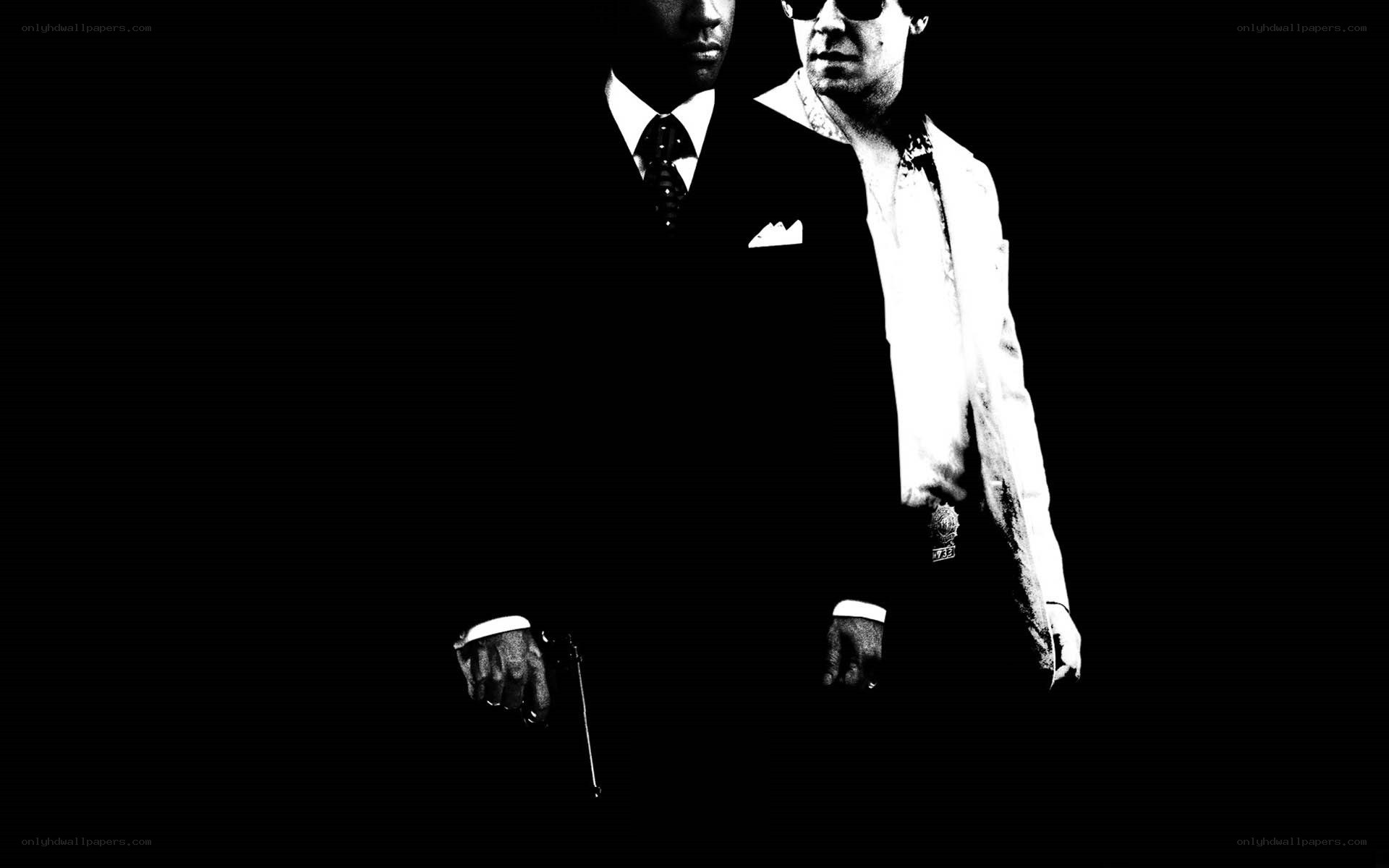 two men in suits with guns