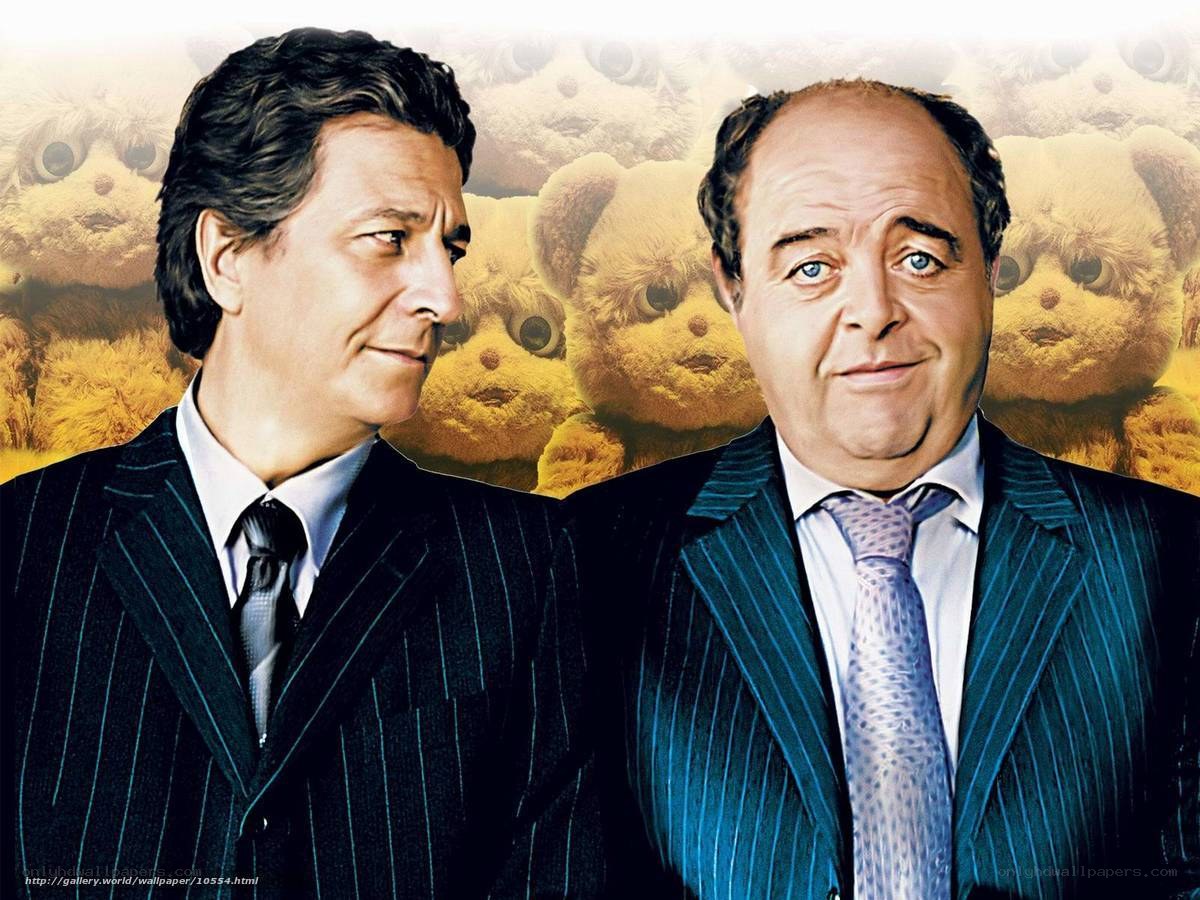 Two men in suits with teddy bears