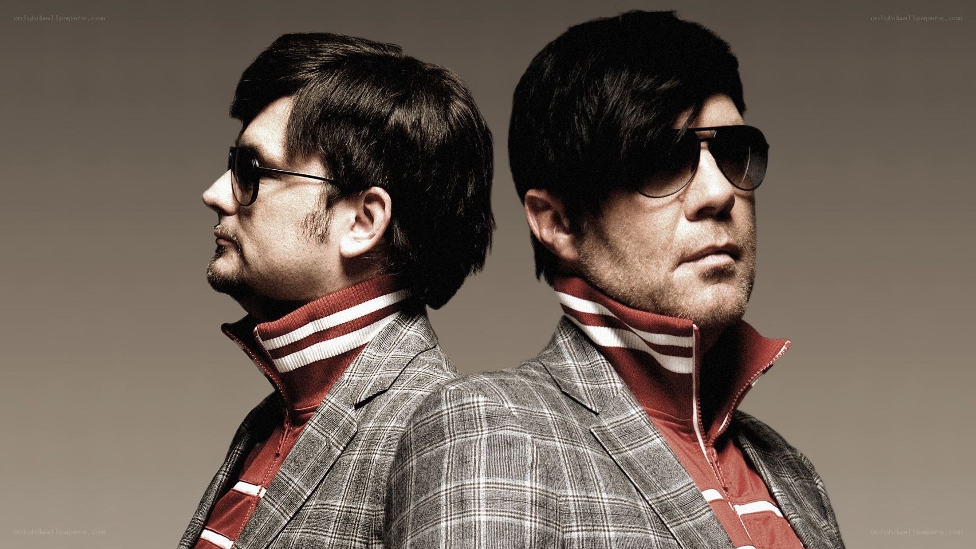 two men in sunglasses and jackets
