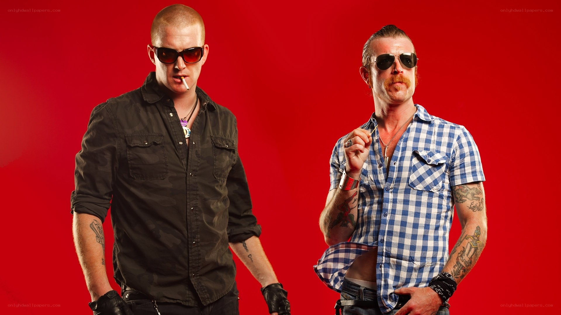 two men in sunglasses on red