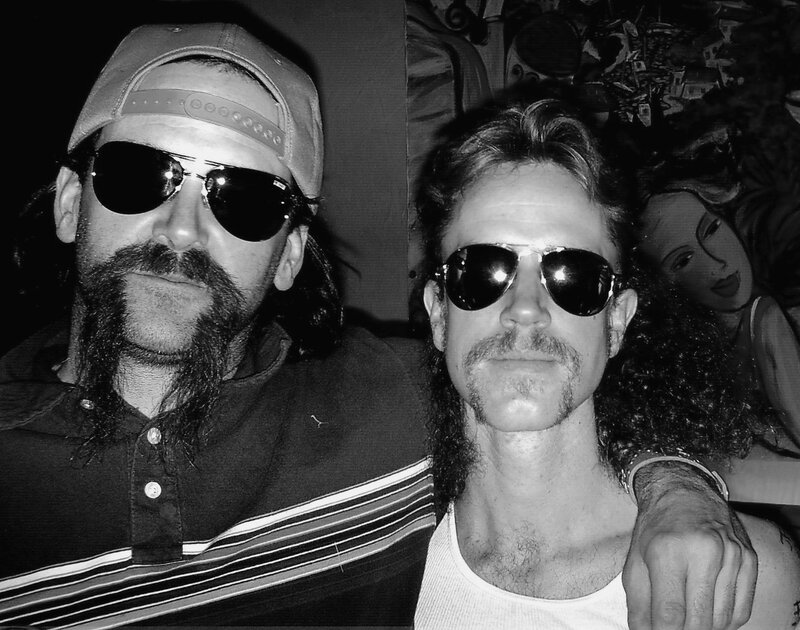 Two men in sunglasses posing