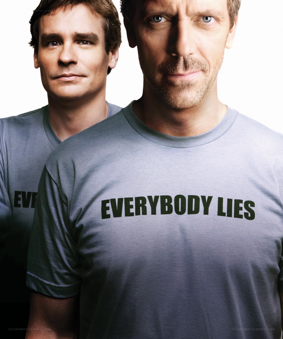 Two men in t-shirts with text
