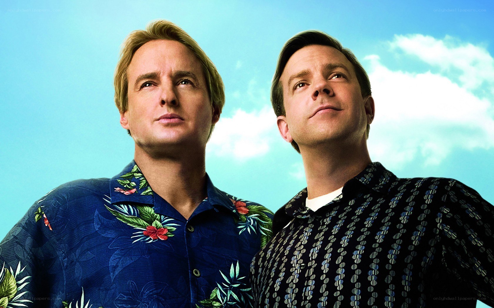 two men in tropical shirts