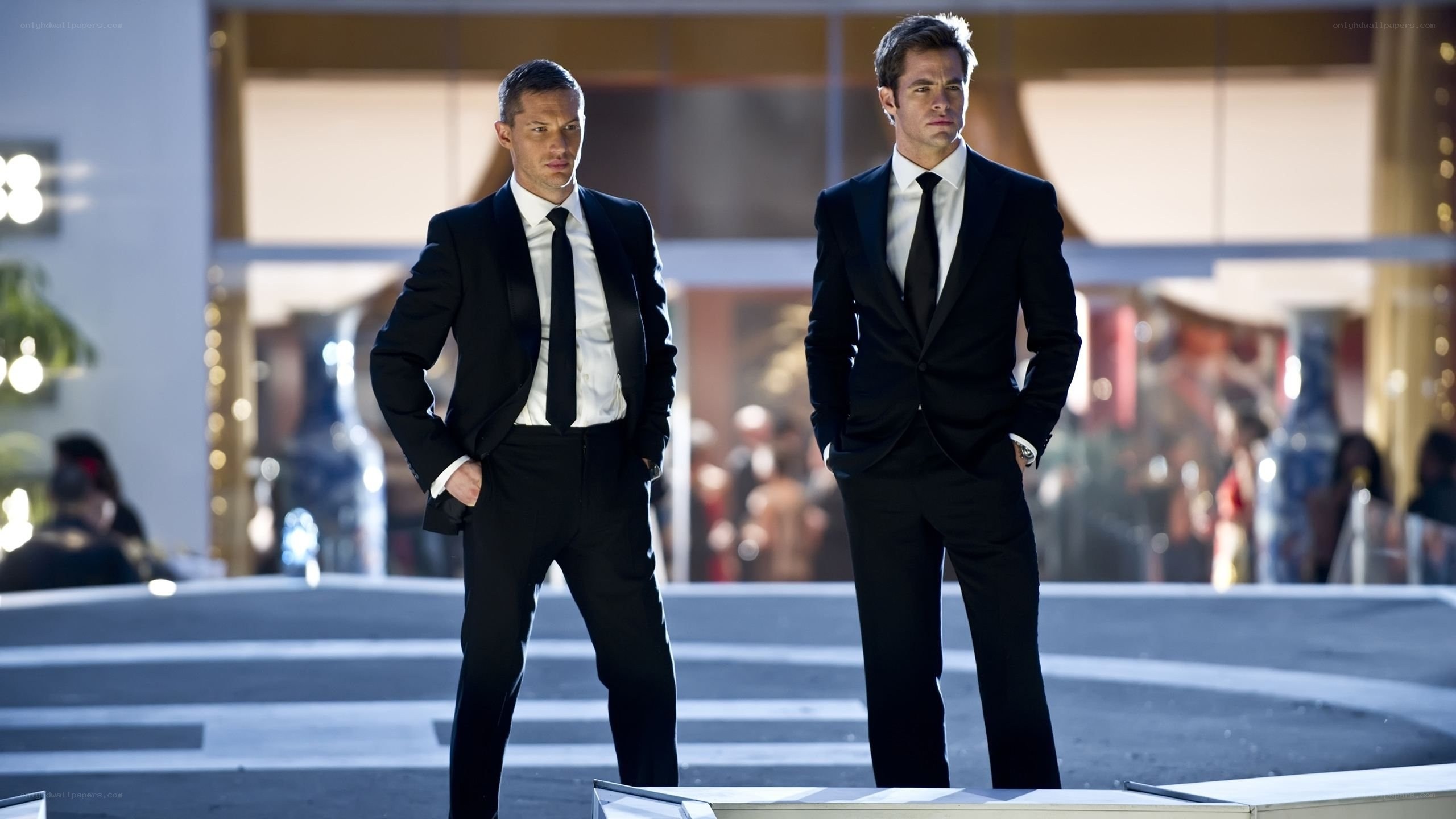 two men in tuxedos standing