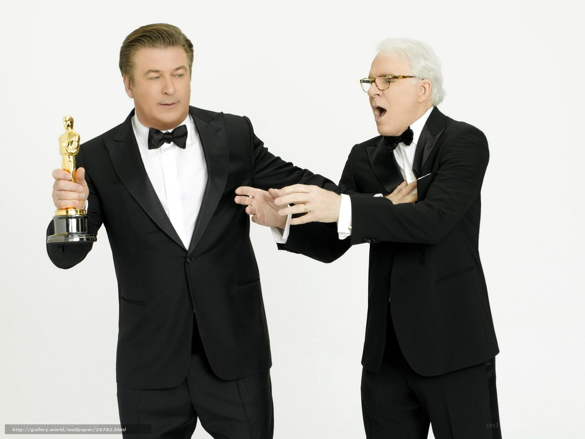 Two men in tuxedos with Oscar