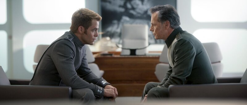 two men in uniform talking