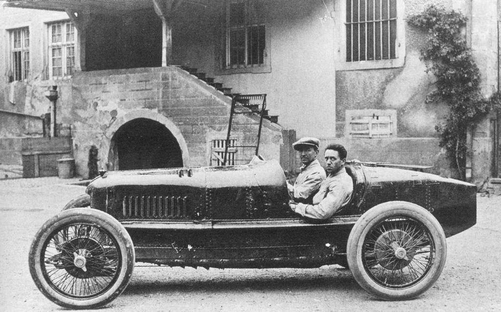 Two men in vintage race car