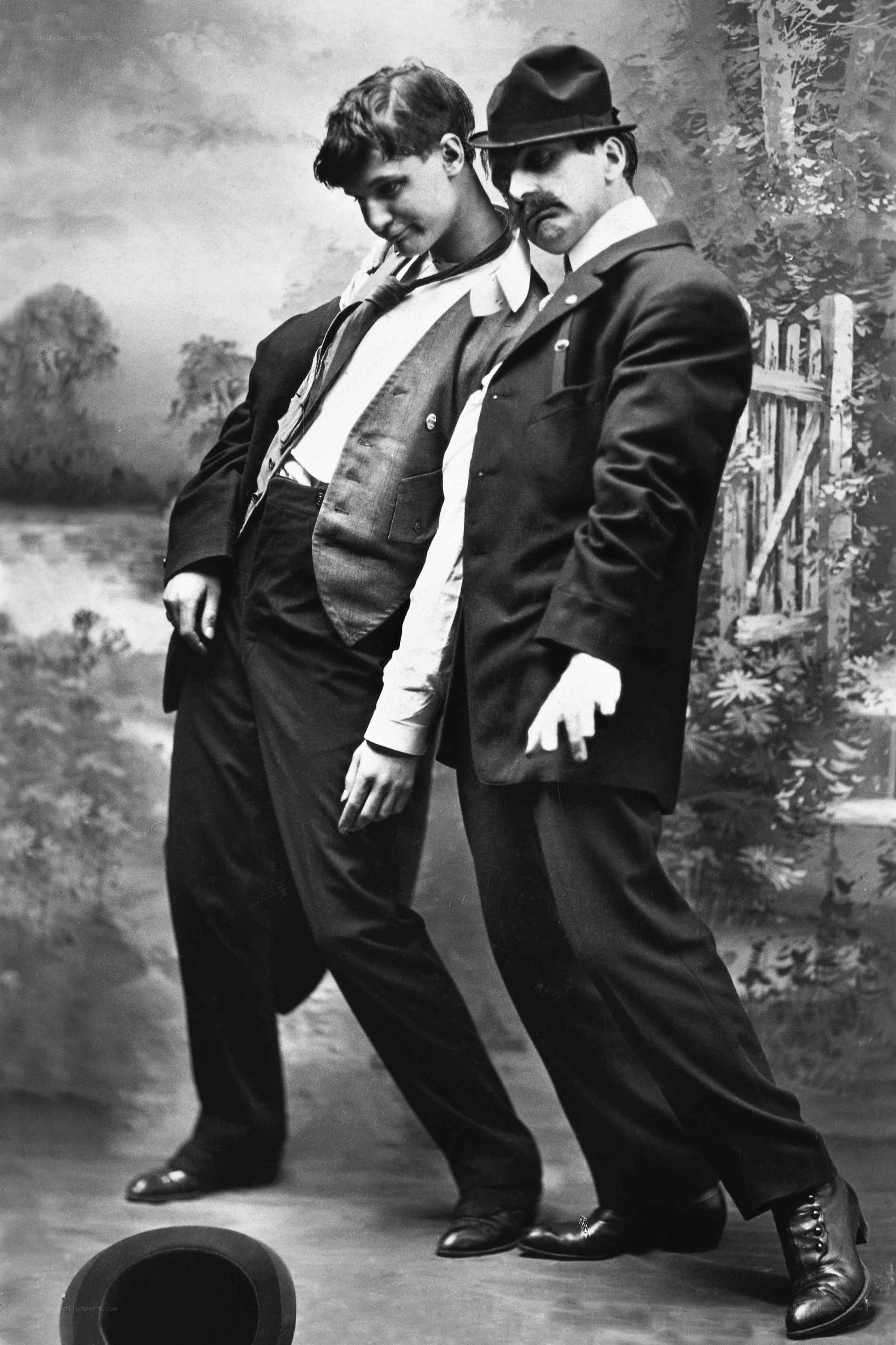 Two men in vintage suits posing