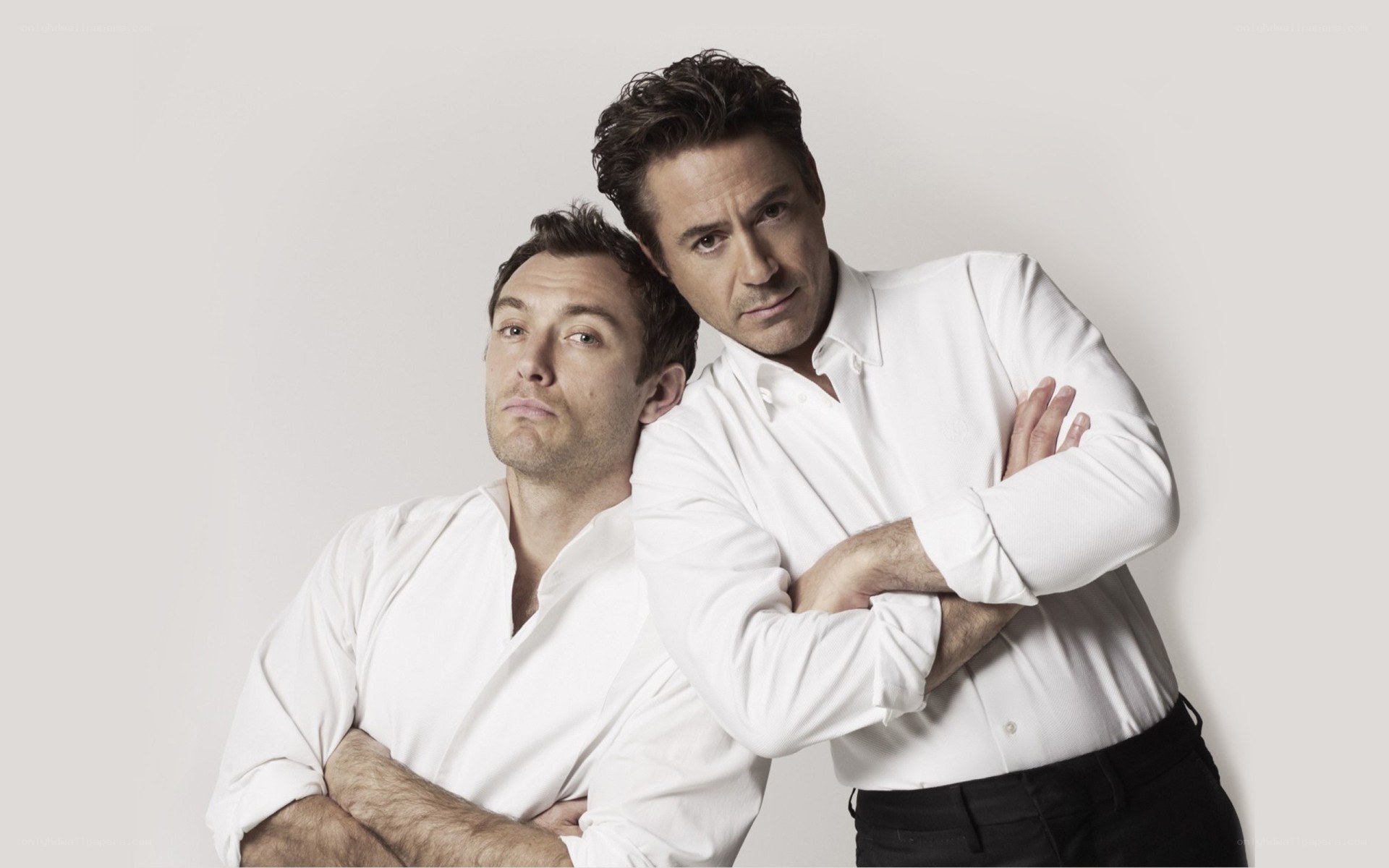 two men in white shirts