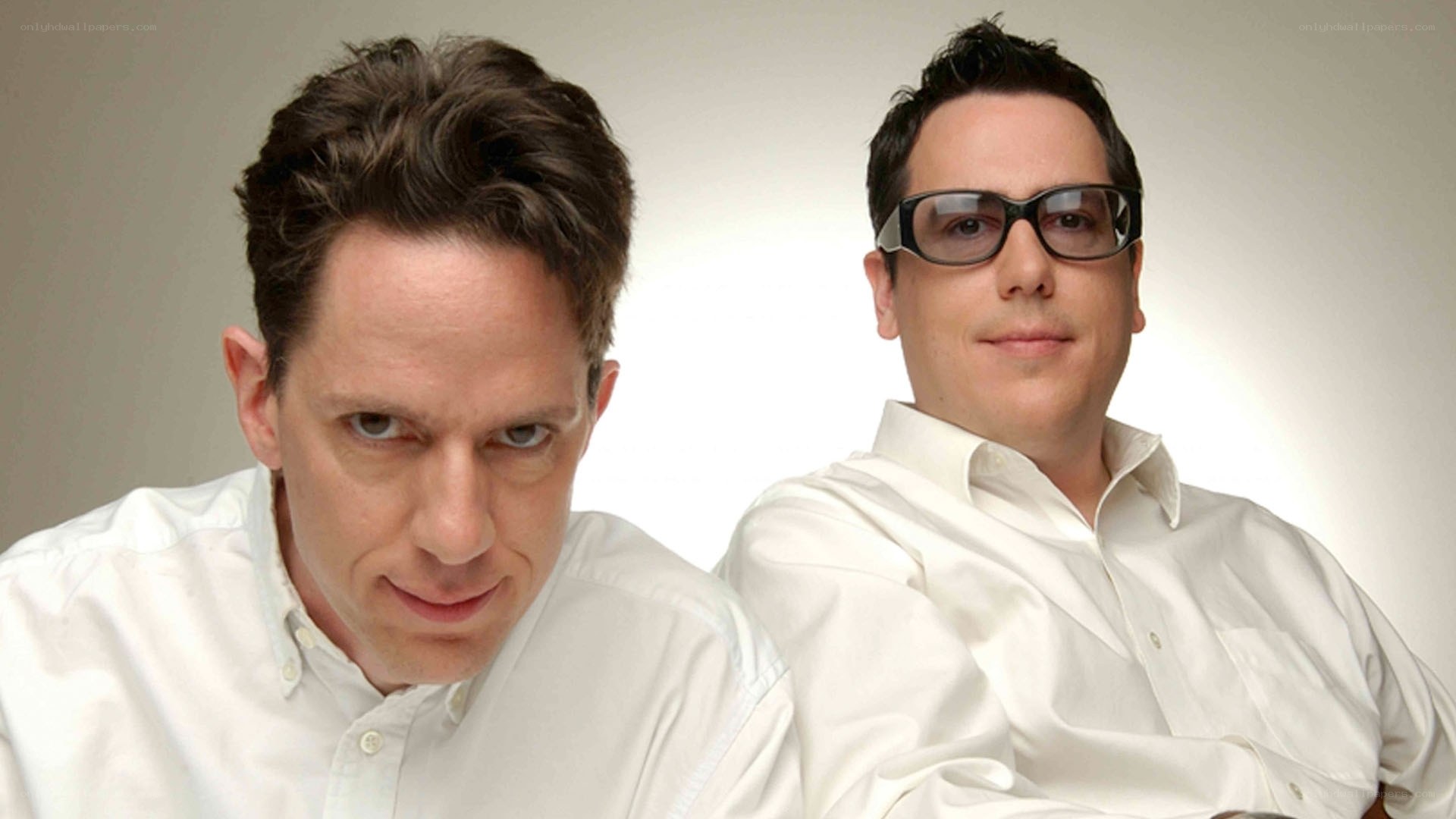 Two men in white shirts