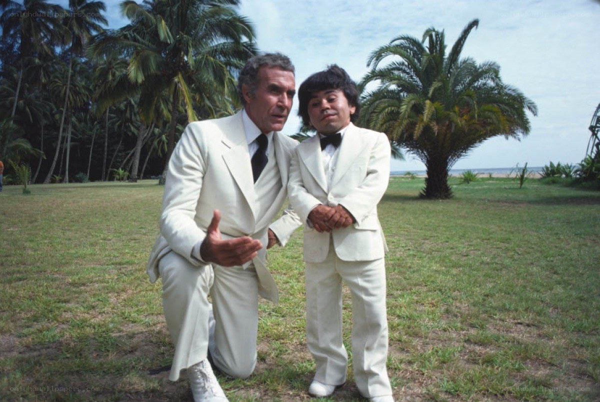 Two men in white suits on a lawn