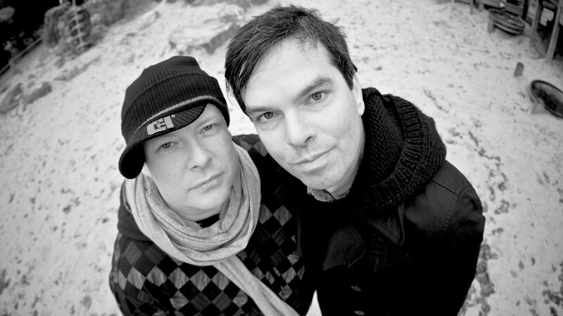 Two Men in Winter Clothing — Black