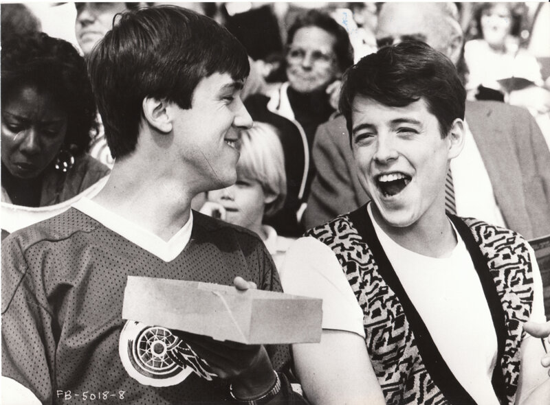 Two men laughing at event
