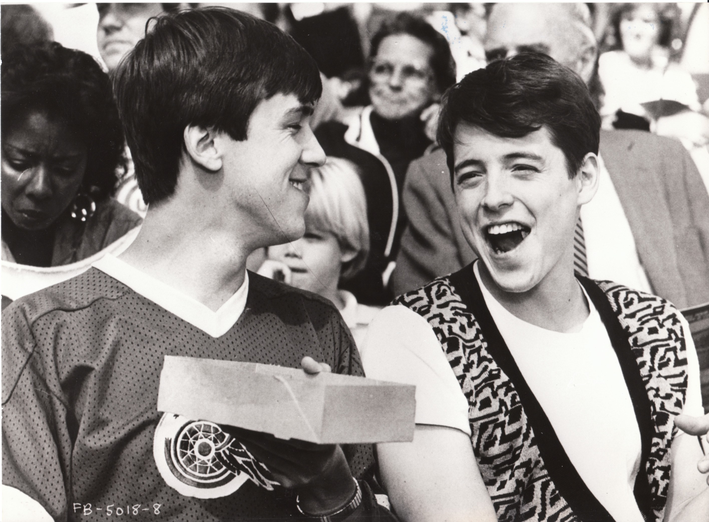 Two men laughing at event