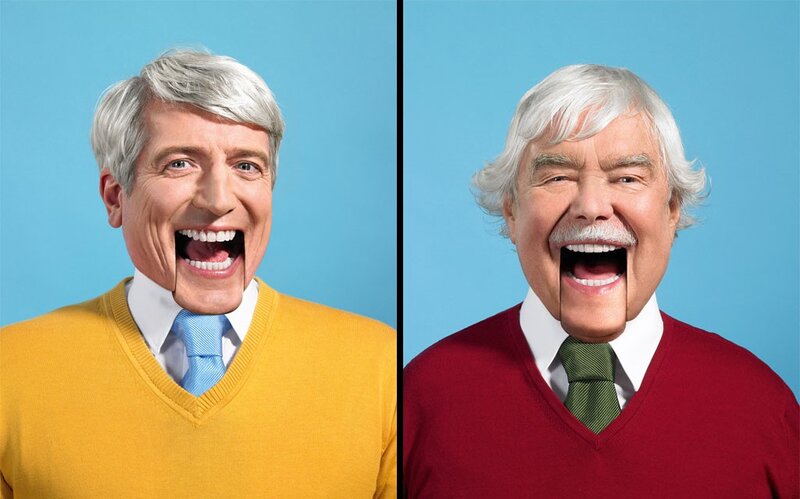 Two men laughing in sweaters